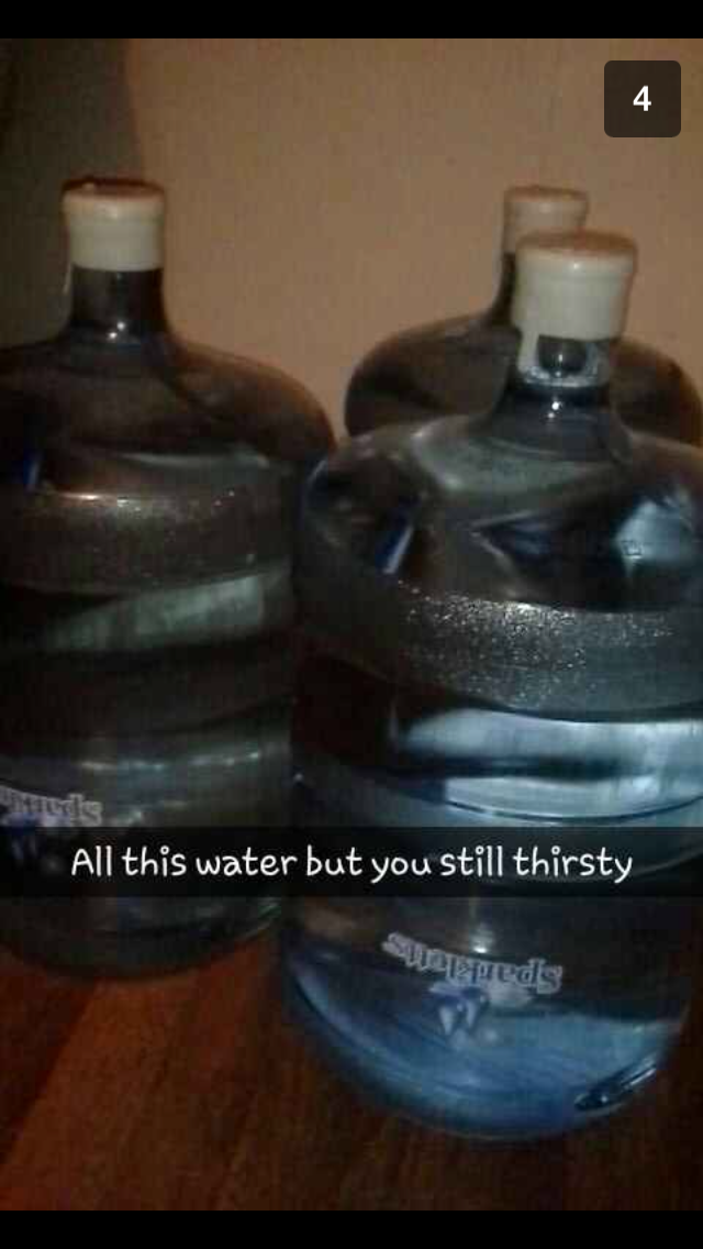 Screenshot of a Snapchat message showing three full 5-gallon water bottles with text reading 'All this water but you still thirsty.'